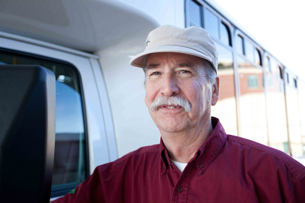 Photo of Ed standing next to bus